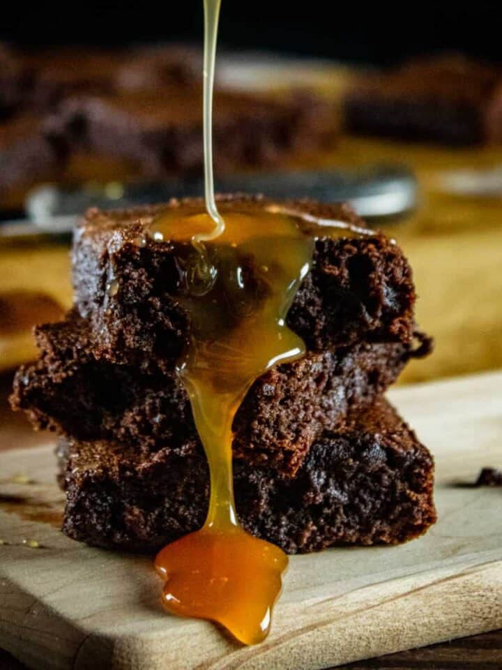 stack of brownies drizzled with caramel