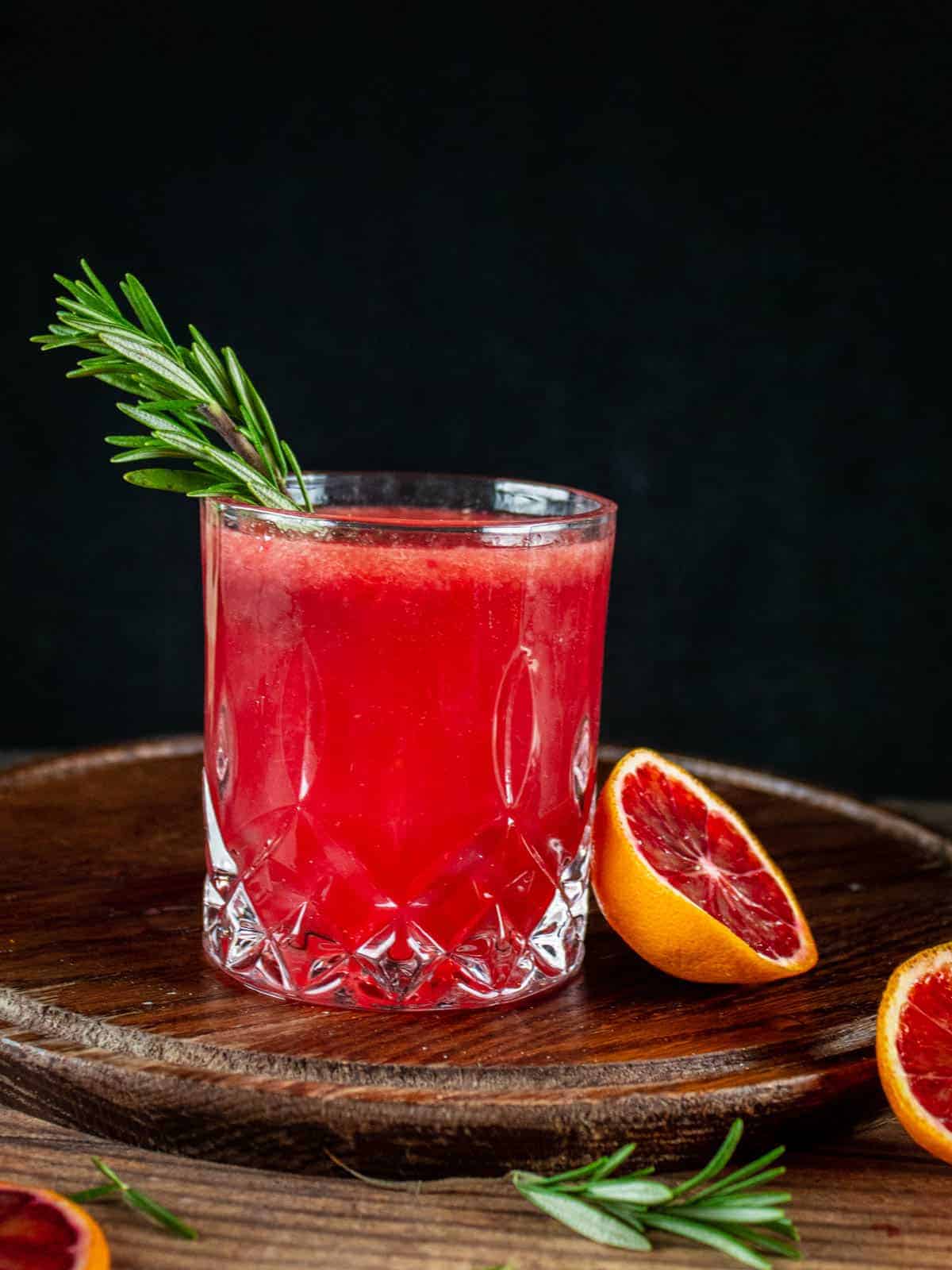 blood orange cocktail with fresh blood orange half