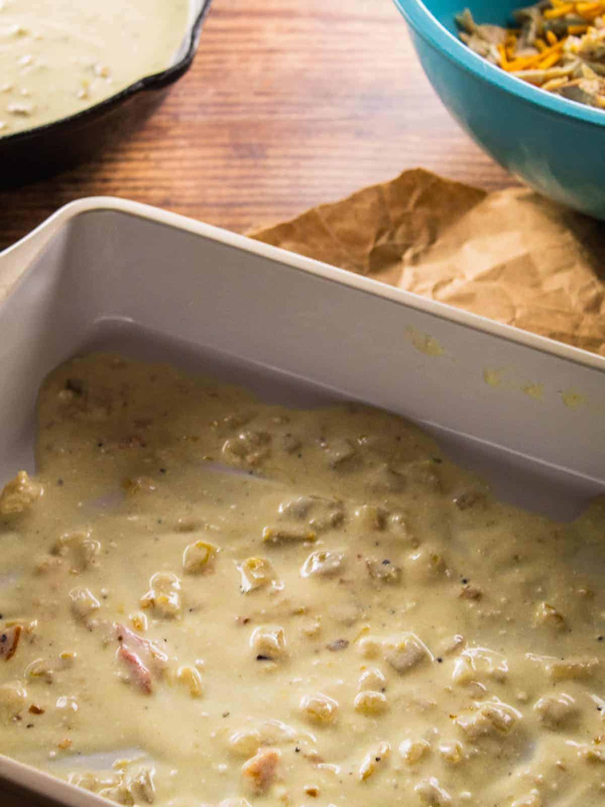 white sauce in the bottom of a baking pan