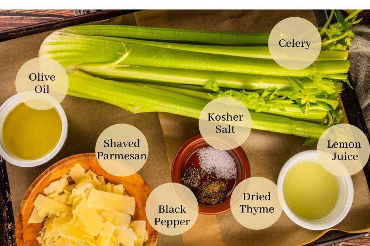 celery, oil, parmesan, salt, pepper, thyme and lemon juice on a sheet pan.