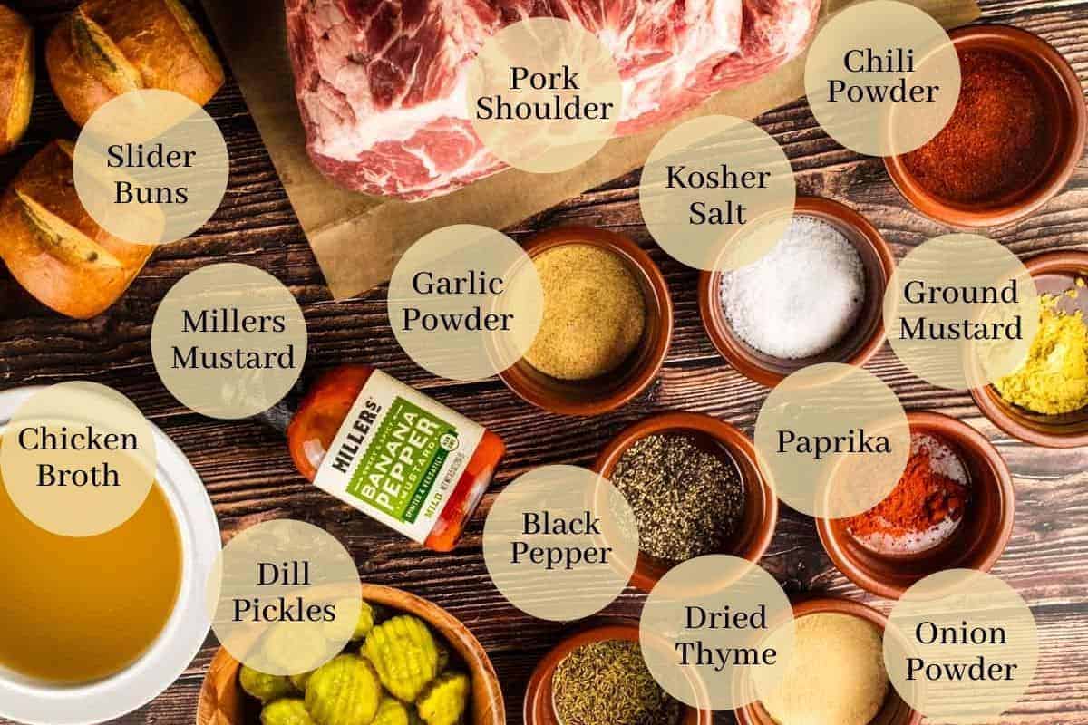 pork shoulder, millers mustard, slider rolls, pickles, broth and seasoning on a sheet pan