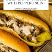 hoagie roll topped with shredded beef with pepperoncini and horseradish sauce
