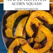 sliced roasted acorn squash on a brown plate on a blue background