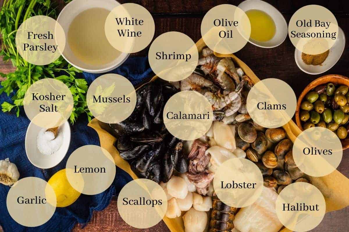 assorted raw seafood on pan, white wine, olive oil, lemon, garlic, old bay seasoning and salt