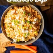 bowl of buffalo chicken dip with carrots, celery and crackers.