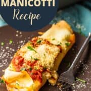 italian manicotti made with crepes on a plate with a fork.