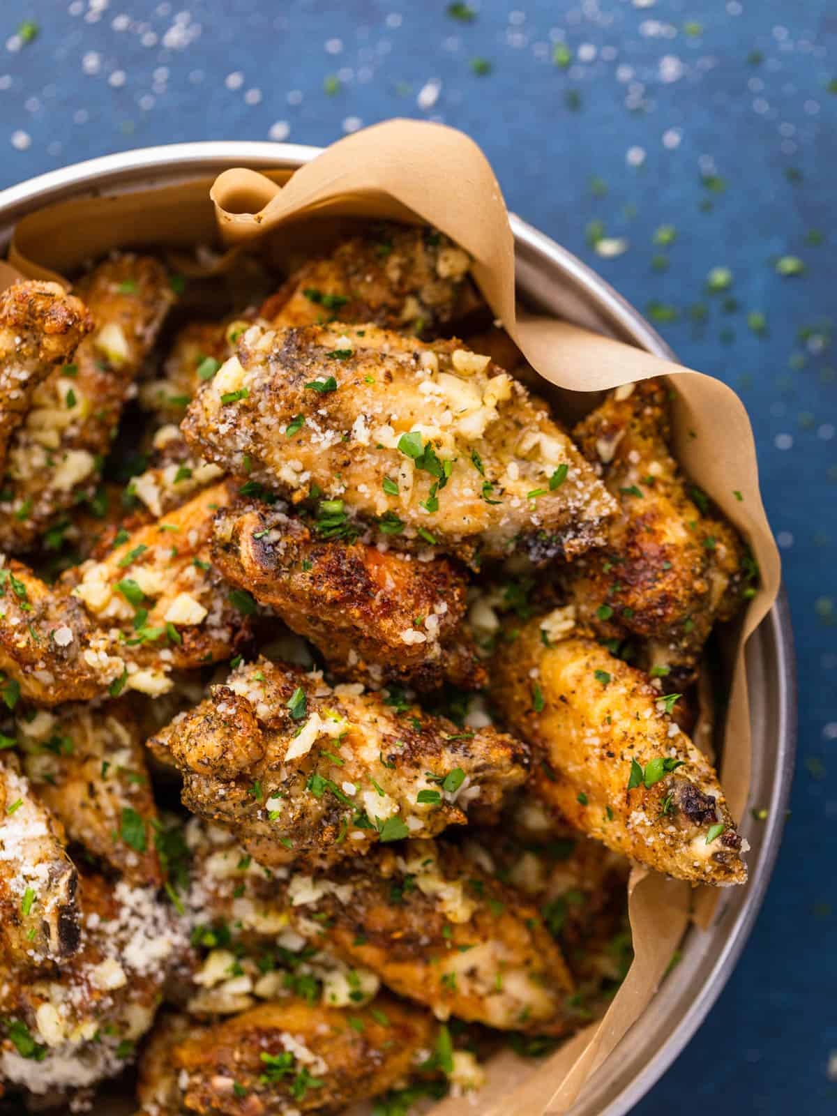 crispy chicken wings topped with fresh garlic, parmesan cheese and chopped fresh parsley.